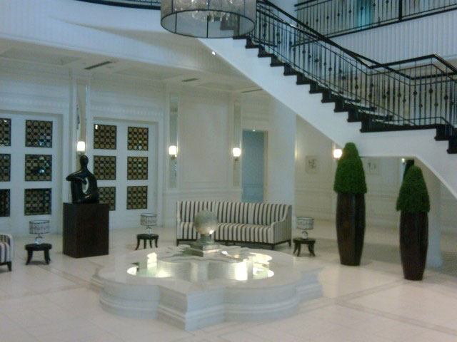 a living room with a couch and a staircase